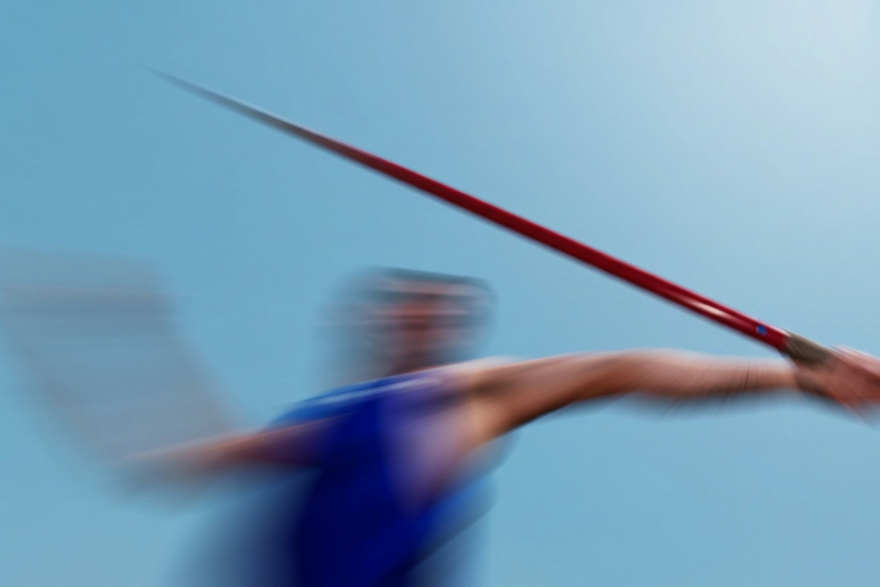 A javelin thrower releasing with precise aim